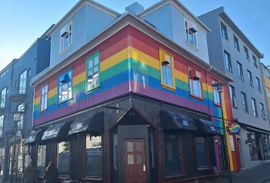 Exterior of Kíkí Queer Bar in Reykjavik, featuring a vibrant rainbow facade, a symbol of LGBTQ+ pride and inclusivity in Iceland's nightlife.
