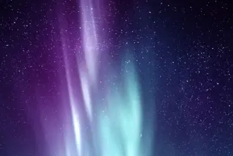 Purple And Blue Aurora Borealis in a Starry Sky in Iceland.