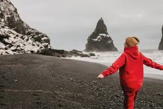 Woman Black Sand Reynisfjara Iceland.