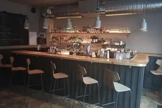 Interior of Veður Wine and Cocktail Bar in Reykjavik, featuring chic interior at the bar.