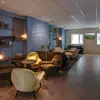 Hotel Klettur modern reception with comfy chairs and cozy seating area.