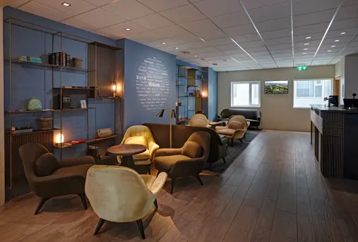 Hotel Klettur modern reception with comfy chairs and cozy seating area.