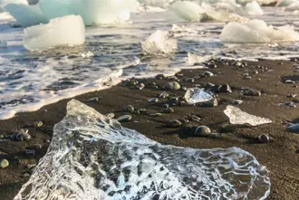 Diamond Beach Black Sand Beach Sparkly Iceberg in Sunset Iceland.