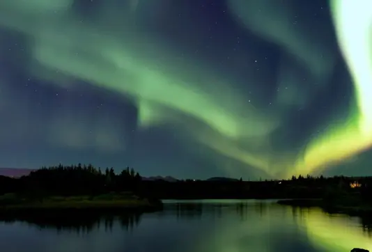 Ellidavatn with Northern Ligths dancing above in Reykjavik.