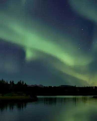 Ellidavatn with Northern Ligths dancing above in Reykjavik.