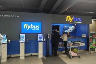 Flybus airport shuttle bus counter at Keflavík International airport in Iceland.