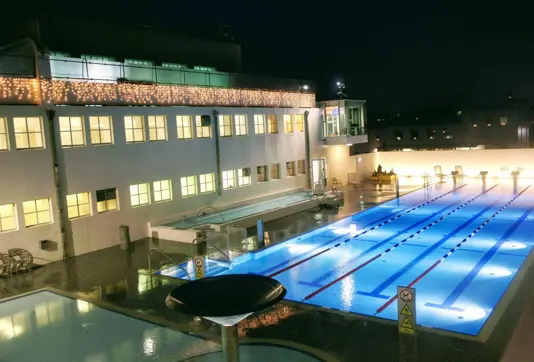 Sundhöll Reykjavíkur, Reykjavik's historic geothermal pool lit up beautifully at night.