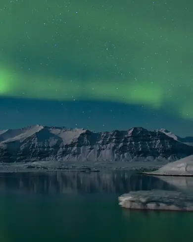 Northern Lights View Over Jokulsarlon Glacier Lagoon From Diamond Beach.