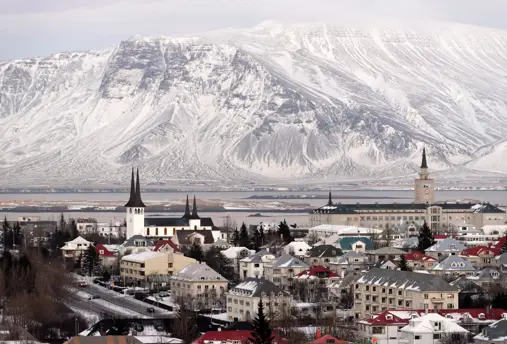 Winter view of Reykjavik with snow-covered mountains in the background