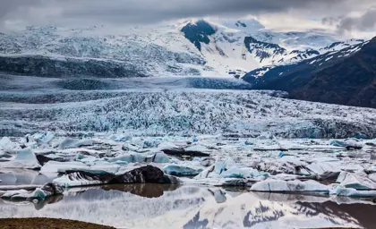 Expansive view of the Vatnajökull glacier in Iceland, showcasing the icebergs and snow-covered landscape.