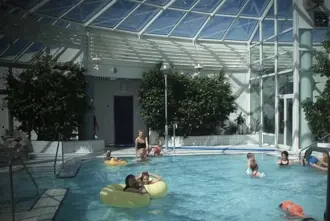 Arbaejarlaug swimming pool indoor area with kids playing.