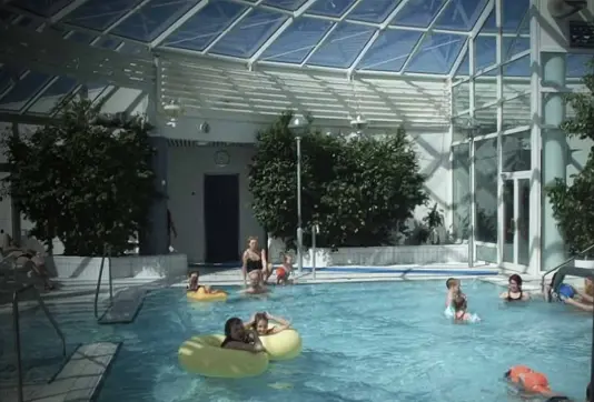 Arbaejarlaug swimming pool indoor area with kids playing.