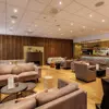 Akureyri Berjaya Iceland Hotels lobby with seating areas and a bar. 