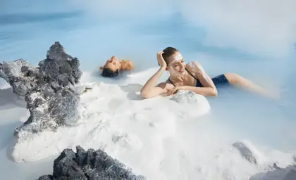 Guests enjoying the waters of the Blue Lagoon from a private transfer tour.