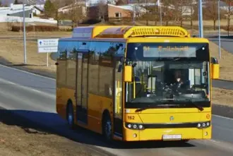 Straeto airport bus driving through Reykjavik city.