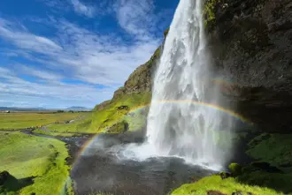 Seljalandsfoss Waterfall Sideview Upclose With Rainbow In Summer Medium