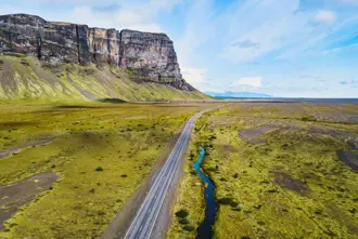 South Coast Iceland Mountain Views And Green Planes From Road Large