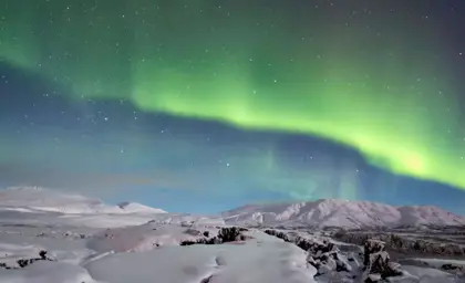 Green Northern Lights over Thingvellir in Iceland.