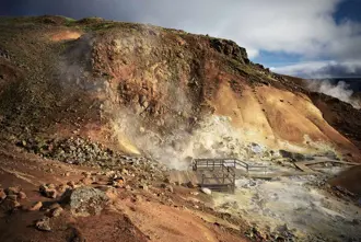 Geothermal steam rising from the hills of Krýsuvík, Iceland