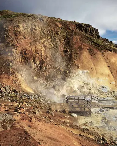 Geothermal steam rising from the hills of Krýsuvík, Iceland