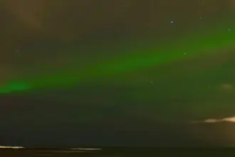 Grotta Lighthouse with Northern Lights above in Reykjavik Iceland.