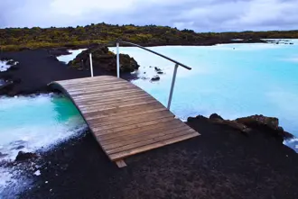 Blue Lagoon With Bridge And Milky Water On Cloudy Day In Iceland Large