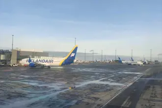 Planes from airlines at Keflavik airport in Iceland parked on the ground.