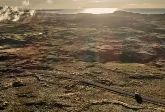 Aerial view of road from Keflavik Airport to Reykjavik on Reykjanes peninsula with lava fields.