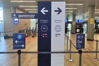 Arrival Passport Control sign at Keflavik Airport in Iceland pointing to EU and non-EU ques.