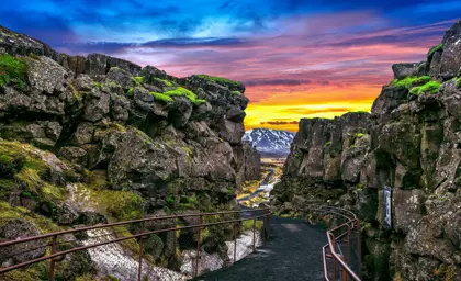 Scenic sunset view through the rift valley path between the Eurasian and North American tectonic plates at Thingvellir National Park in Iceland.