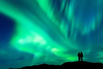 People Couple Viewing Aurora Green Sky.
