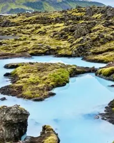 The Blue Lagoon surrounded by a moss grown lava field in Reykjanes Iceland.