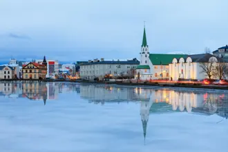 Reflection Reykjavik Free Church Tjornin Winter Blue Hour Travelreykjavik.Jpg Medium