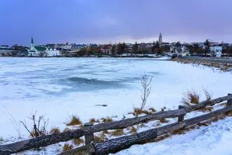 Lake Tjornin View Of Reykjavik In Winter Large